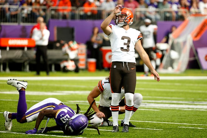 Cleveland Browns kicker Chase McLaughlin (3) kicks a 48-yard field goal in front of Minnesota Vikings cornerback Harrison Hand (20) during the first half of an NFL football game, Sunday, Oct. 3, 2021, in Minneapolis. (AP Photo/Bruce Kluckhohn)