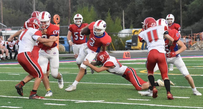 Junior quarterback Brody Lester evades the tackle for positive yardage. Lester helped lead the Patriots to their sixth victory of the season. Owen Valley defeated the Eastern Greene Thunderbirds, 67-0. More from Friday's game is featured in today's Spencer Evening World.