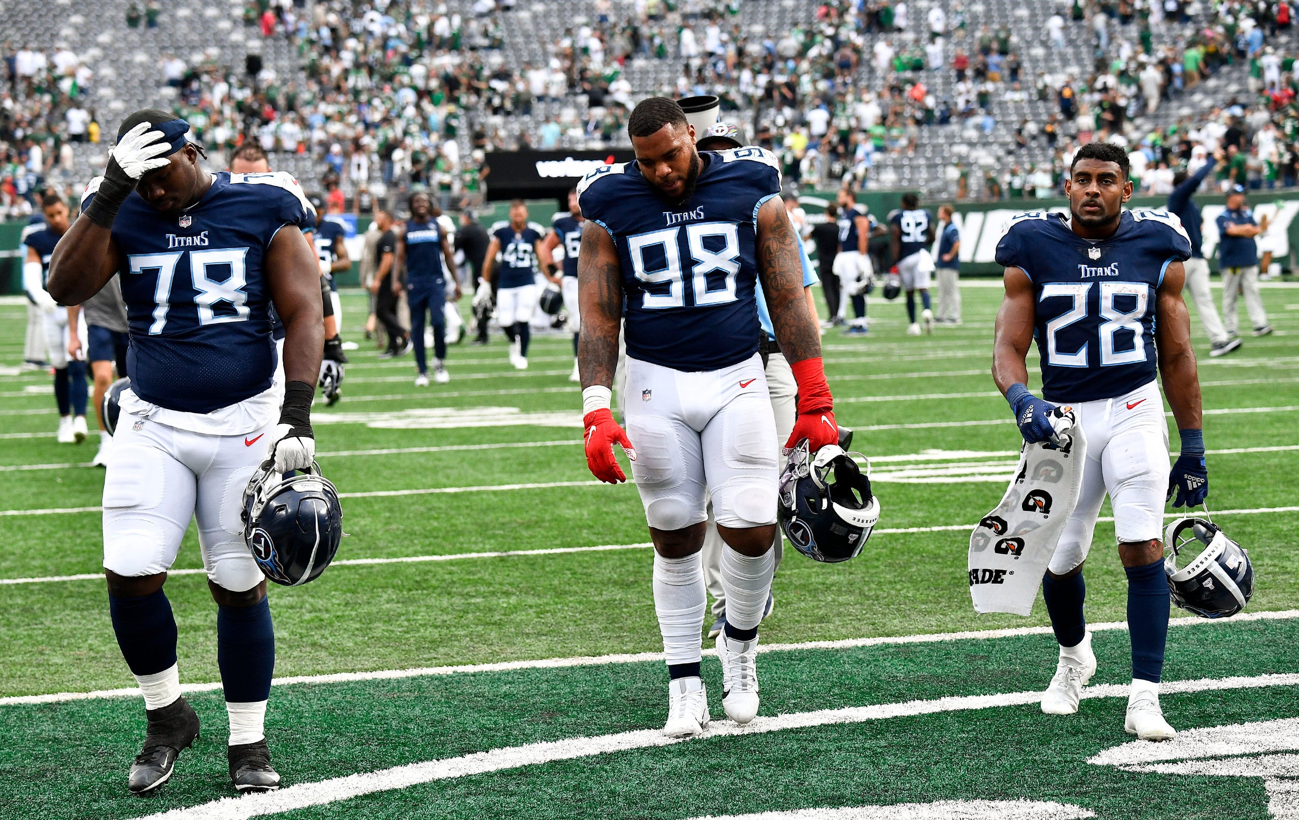 The Titans leave the field after losing to the Jets in overtime at MetLife Stadium Sunday, Oct. 3, 2021 in East Rutherford, N.J.