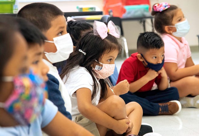 Masked up students at Belvedere Elementary School in West Palm Beach Tuesday, Aug. 10, 2021, the first day of the school year. Gov. Ron DeSantis has barred school districts from imposing mask mandates for students.