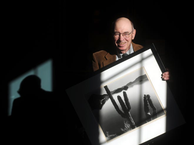 Stephen B. Jareckie, Fitchburg Art Museum photography adviser, holds a photograph by Brett Weston. Jareckie died at age 92 on Sept. 25.