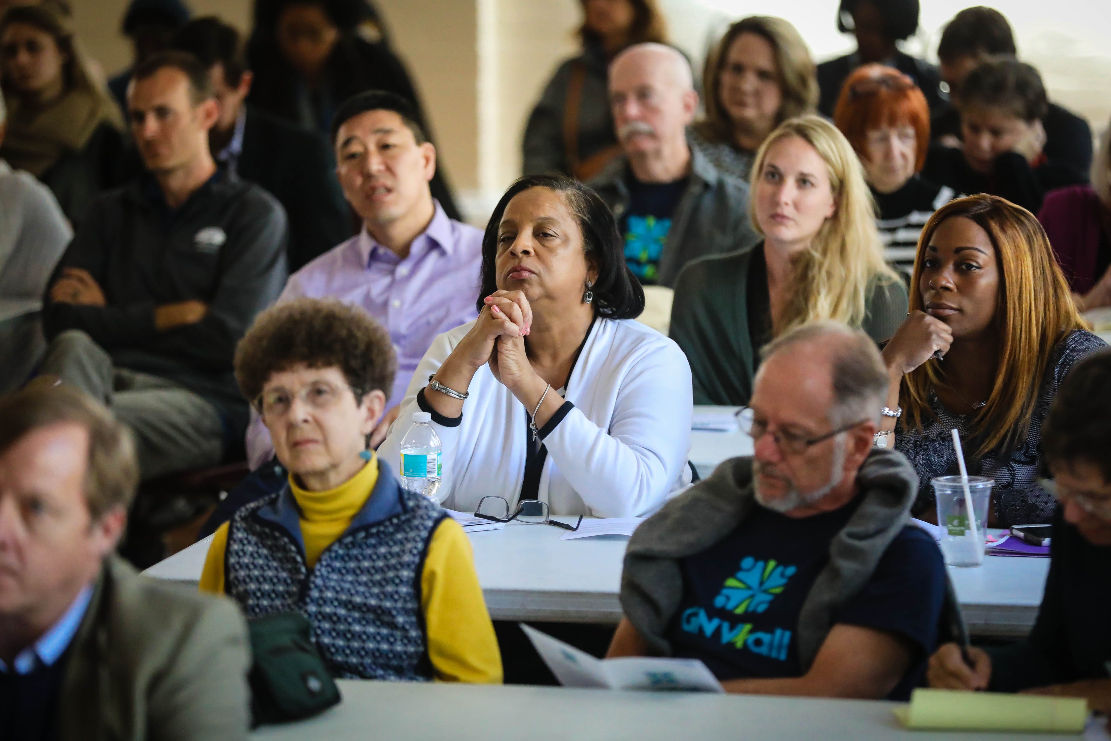 Attendees watch presentations being made at the Gainesville For All kickoff event in 2016.
