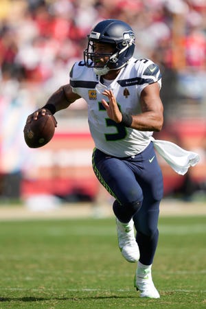 Seattle Seahawks quarterback Russell Wilson (3) runs for a touchdown against the San Francisco 49ers during the second half of an NFL football game in Santa Clara, Calif., Sunday, Oct. 3, 2021. (AP Photo/Tony Avelar)