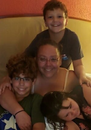 Jessie Small, 37, with her three children. The Louisville family has not been seen since Sept. 19.