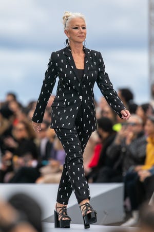 Actress Helen Mirren walks the runway during the "Le Defile L'Oreal Paris 2021" Womenswear Spring/Summer 2022 show as part of Paris Fashion Week on October 03, 2021 in Paris, France.
