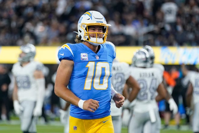 Justin Herbert reacts after one of his three first-half touchdown passes in Monday's 28-14 win by the Los Angeles Chargers over the Las Vegas Raiders in Los Angeles.
