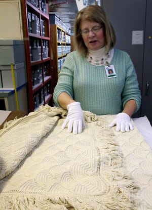 In 2015, curator Leslie Bellais of the Wisconsin Historical Society inspects a bedspread purported to have come from Abraham Lincoln's death bed. In 2026 the society plans to open an expanded history museum next to the Capitol in Madison.