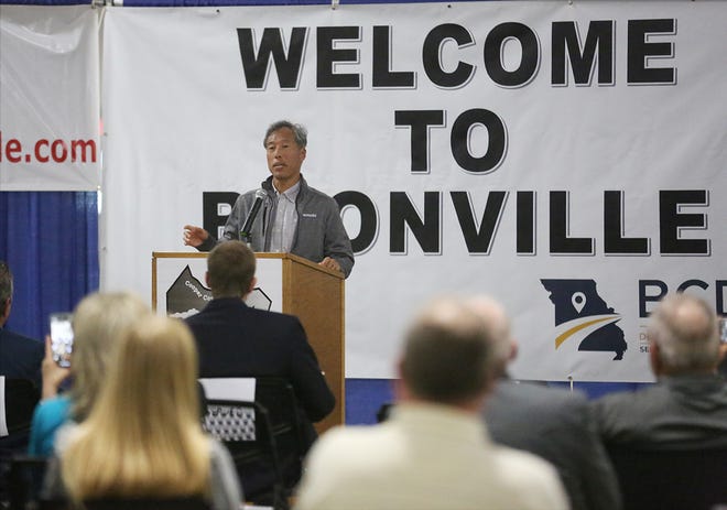 Yutaka "Joe" Tabata, president of Kawasaki Motors Manufacturing Corp., U.S.A., speaks to a crowd at the former Nordyne plant Wednesday to announce that Kawasaki is opening up a manufacturing plant in Boonville.