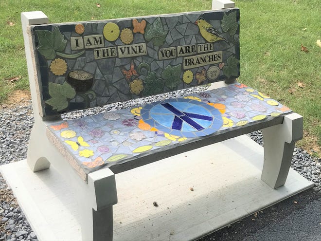 Threse Baywood sponsored this mosaic art bench along the nature trail. She said she chose this Bible verse as both a reference to her faith and as an example of the connections residents have to Laurel View Village.