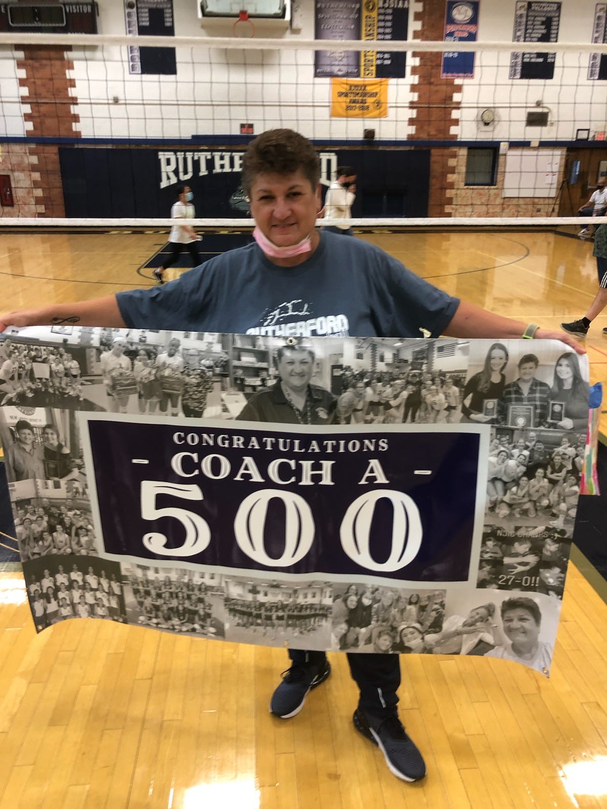 Rutherford girls volleyball coach Helen Antzoulides was presented with a banner commemorating her 500th career win after her Bulldogs defeated St. Mary, 2-0, in an NJIC match on Friday, Oct. 2, 2021.