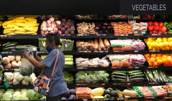 Evelyn Jennings buys groceries Oct. 7 at the Homeland at NE 36 and Lincoln Boulevard.