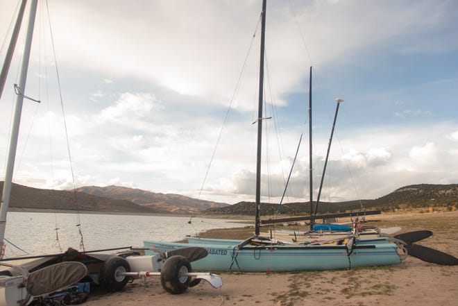 Docks and boats sit on dry ground as water at Rockport Reservoir in Utah on Oct. 6, 2021. Reservoirs across the state reached record lows over the past year following years of drought and below-average amounts of mountain snow.