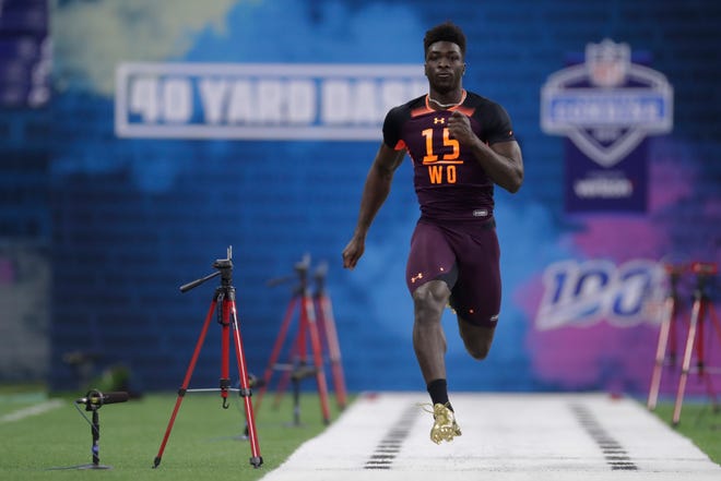 Malone wide receiver Ashton Dulin runs the 40-yard dash at the NFL football scouting combine in Indianapolis, Saturday, March 2, 2019. (AP Photo/Michael Conroy)