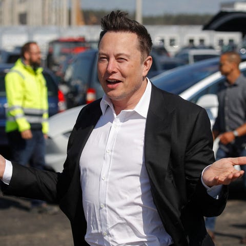 Tesla CEO Elon Musk gestures as he arrives to visi