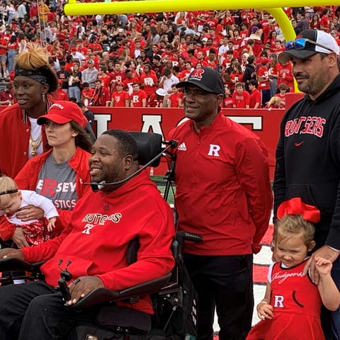 Eric LeGrand (center) and other members of Rutgers