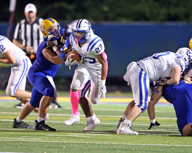 Wyoming running back C.J. Hester breaks through the Mariemont line with some good blocking by the Cowboy's O-line. The action happened in the third quarter in the game between Wyoming and Mariemont high schools at Mariemont High School Oct. 8, 2021.