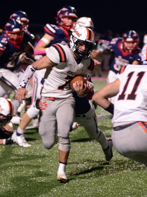 Ridgewood's Xavier Lamneck runs with the ball during a 17-14 win against host Indian Valley on Friday in Gnadenhutten.