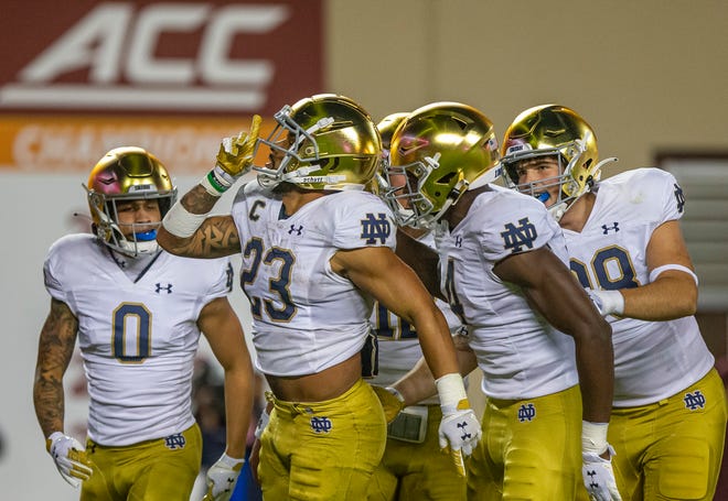 Notre Dame running back Kyren Williams (23) celebrates a touchdown during ND's 32-29 win over Virginia Tech, Saturday, Oct. 9, 2021, in Blacksburg, Va.