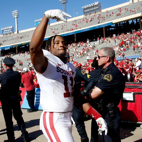 Nik Bonitto (11) gives the Horns Down gesture afte
