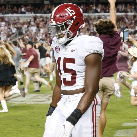 Alabama linebacker Dallas Turner (15) walks off as