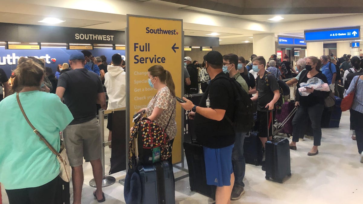 The Southwest Airlines rebooking line at Phoenix Sky Harbor International Airport on Sunday, Oct. 10. Southwest Airlines has canceled more than 1,000 Sunday flights across the country  after canceling 800 on Saturday.