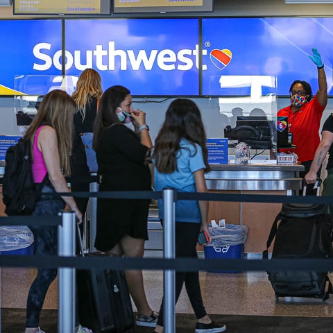 A Southwest Airlines employee calls for the next c