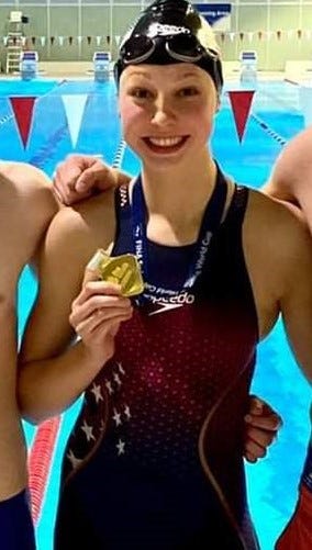Bloomington South senior and Indiana Swim Club member Kristina Paegle poses with her relay gold medal after the 2021 FINA World Cup in Berlin.