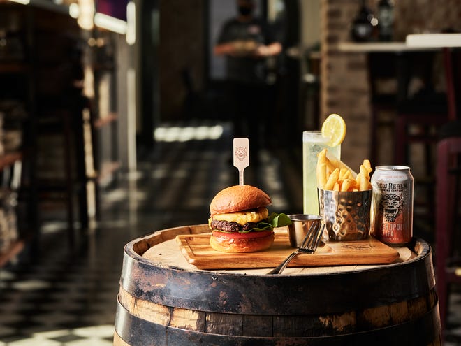 New Realm Brewing Company is planning to open a brewery and restaurant in the Old Cigar Warehouse space in Greenville's West End. Pictured is the Wagyu beef burger and the Hoptropolis brew.