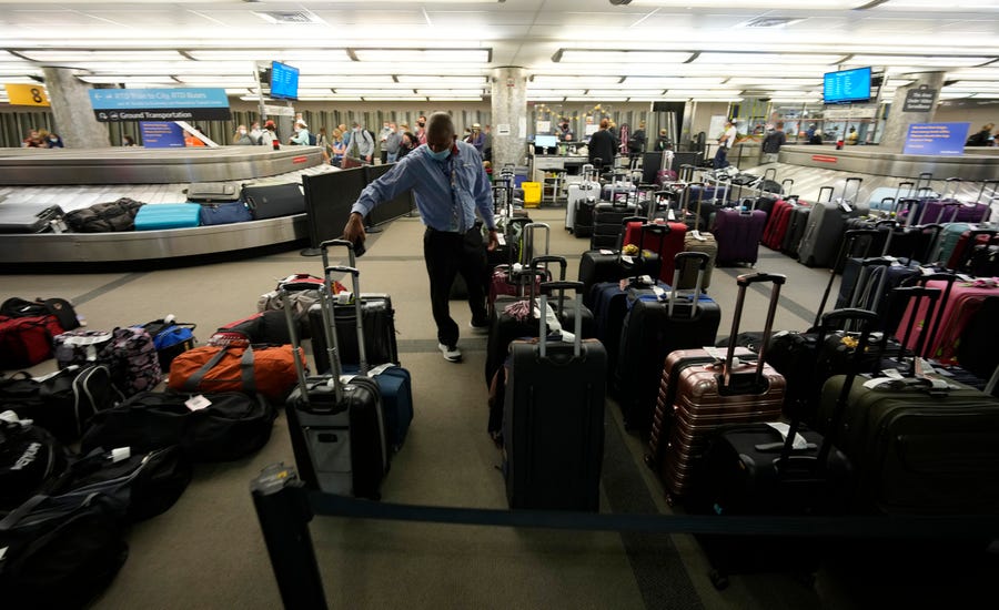 Unclaimed baggage wells up between carousels for passengers arriving on Southwest Airlines flights at Denver International Airport Oct. 10.