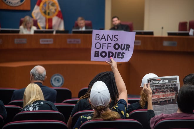 Pro-choice advocates rallied during Tuesday's county commission meeting in opposition to a proposed local abortion restriction ordinance.
