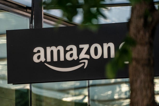 A sign is seen outside of an Amazon Go store at the Amazon.com Inc. headquarters on May 20, 2021 in Seattle, Washington.
