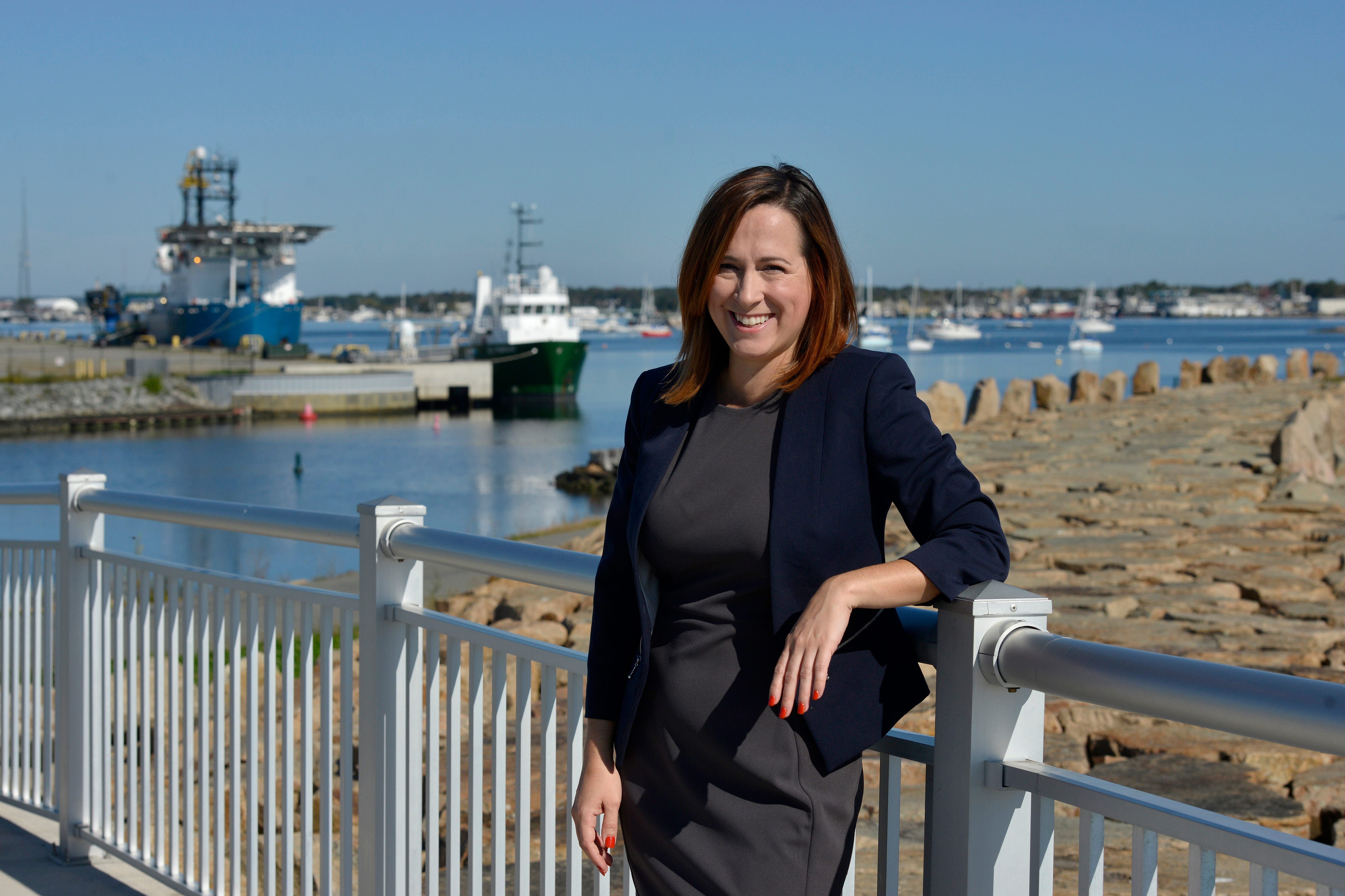 Elise Rapoza, assistant director of corporate engagement at the University of Massachusetts-Dartmouth, stands at the New Bedford Marine Commerce Terminal on Oct. 13, 2021. The terminal will be used as an onshore support facility for the construction, maintenance and operation of offshore wind farms that will be built south of Martha's Vineyard.