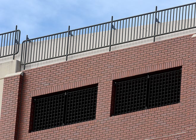 Construction of safety enhancements have begun on upper-level windows of the Fifth and Walnut Parking Garage. An 8-foot-tall barrier will be erected on the top floor of the garage to prevent people from jumping from the structure.