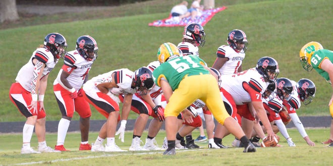 Central Davidson's offense lines up to run a play against West Davidson. The Spartans are second in the state in rushing yardage. [Mike Duprez/The Dispatch]