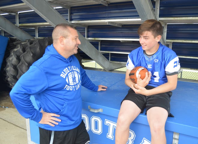 Harper Creek head coach Mason Converse, left, with his son Cameron, who recently had heart surgery to correct a condition called Wolff-Parkinson-White syndrome.