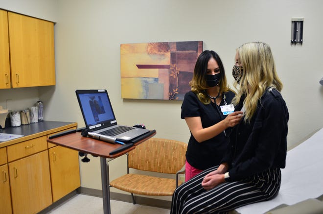 A patient is seen in an examination room at the Gerald Champion Regional Medical Center as part of the hospital's telesealth program.