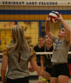 Veribest's Olivia Abbott, right, sets the ball during a District 7-2A showdown against Water Valley at the Veribest gym on Tuesday, Oct. 12, 2021.