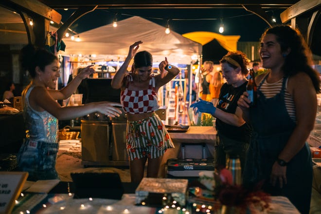 The Bandidas founders dance and drink at their October Pride social event.
