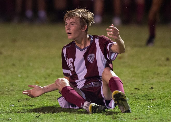 Henderson's Jack Gentry (16) reacts to not receiving the foul as the Henderson County Colonels face the Madisonville-North Hopkins Maroons in the 2nd Region Soccer Tournament semifinals at the Stadium of Champions in Hopkinsville, Ky., Wednesday evening, Oct. 13, 2021.