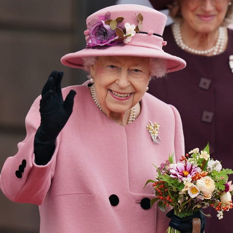 Queen Elizabeth II waves as she leaves after atten