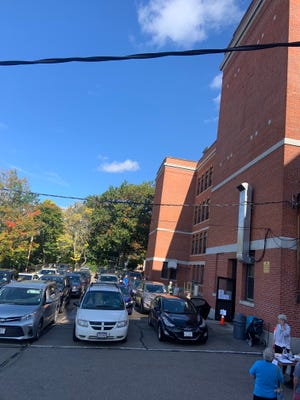 Organizers at the annual Fall Bazaar at Holy Family Academy in Gardner said they expected to sell around 1,800 poutines and 1,500 rappes through a drive-thru set up at the school’s Regan Street parking lot.