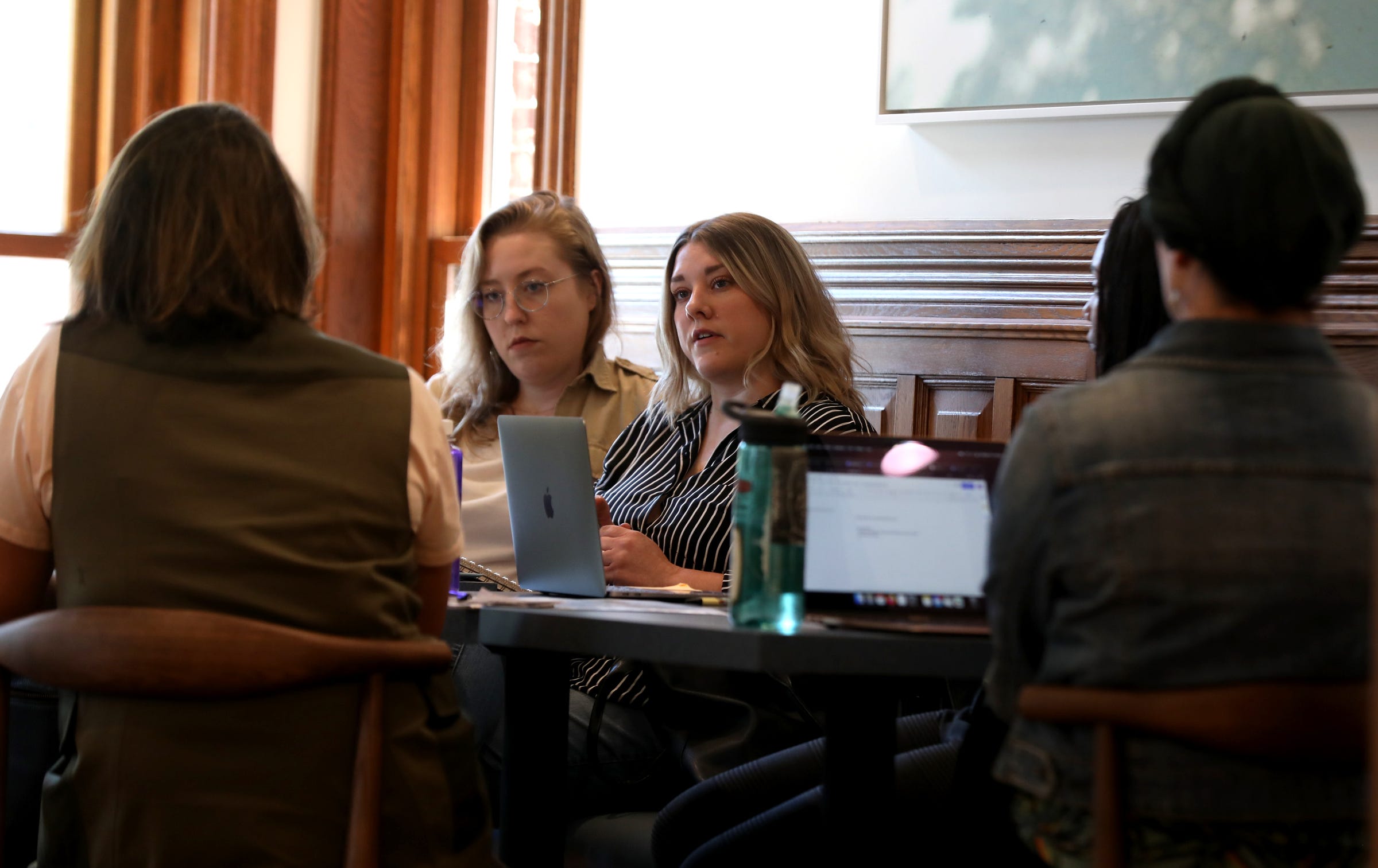 (middle) Mary Beth Beaudry with Marrow, a food and beverage partner with BasBlue listens to others during a meeting at the house on Ferry Street in Detroit on October 13, 2021. When BasBlue opens near the end of October it will be a membership organization for women to join and support other women across the metro Detroit with an area to work, meet, get mentorship help along with career advice and guidance.