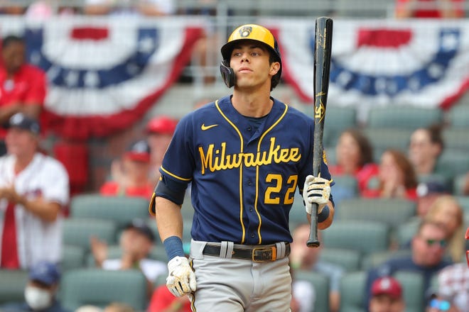 Christian Yelich bats during the second inning against the Atlanta Braves in game four of the National League Division Series at Truist Park on October 12, 2021 in Atlanta, Georgia.