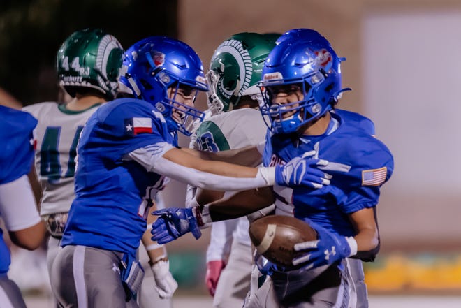 Americas celebrates at a high school football game against Montwood at the Socorro ISD Student Activities Center on Thursday, Oct. 14, 2021, in El Paso, Texas.