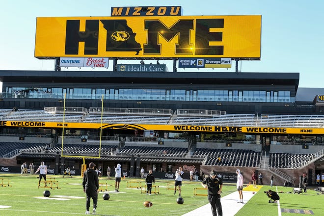 Missouri football players warm up prior to a game at Faurot Field.