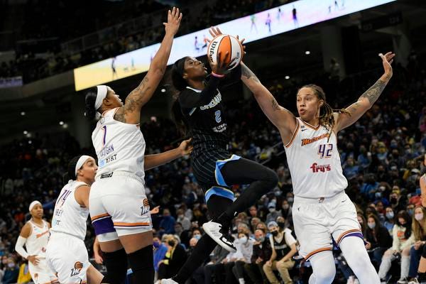 Chicago Sky's Kahleah Copper (2) goes up to shoot the basketball against Phoenix Mercury's Brittney Griner (42) and Kia Vaughn (1) during the first half of Game 3 of the WNBA Finals, Friday, Oct. 15, 2021, in Chicago.