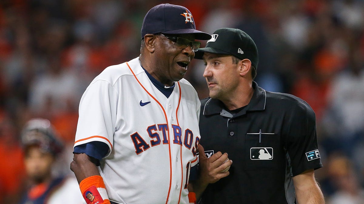 Houston Astros manager Dusty Baker talks with home plate umpire David Rackley during the sixth inning of Game 1 against the Boston Red Sox.
