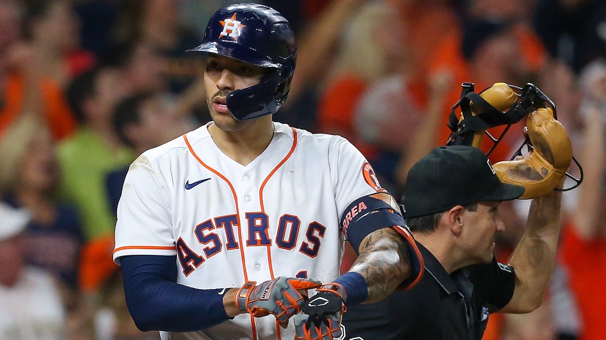 Houston Astros shortstop Carlos Correa reacts after hitting a go-ahead solo home run in the seventh inning against the Boston Red Sox.