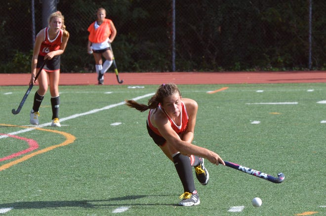 Ocean City junior Andi Helphenstine sweeps a pass to a teammate against Haddonfield