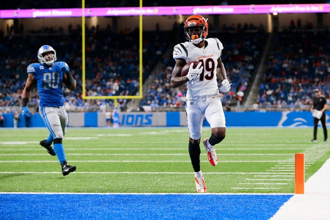Cincinnati Bengals wide receiver Auden Tate (19) catches a short pass and runs in for a touchdown in the fourth quarter of the NFL Week 6 game between the Detroit Lions and the Cincinnati Bengals at Ford Field in Detroit on Sunday, Oct. 17, 2021. The Bengals held the lead the entire game and finished with a 34-11 win in Detroit. 